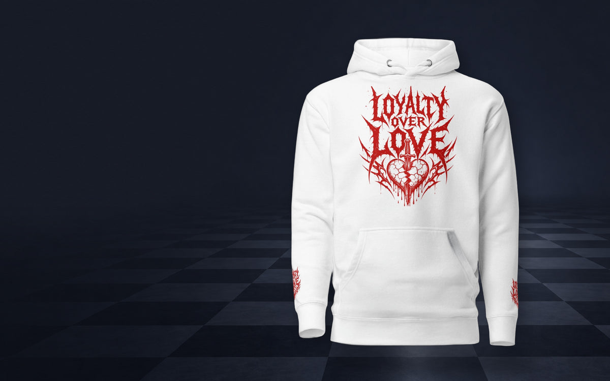 White ChessStrology Loyalty Over Love hoodie with red print standing on a dark chessboard floor